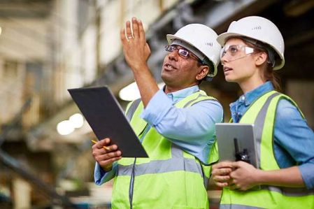 MAle engineer showing the project to his colleague